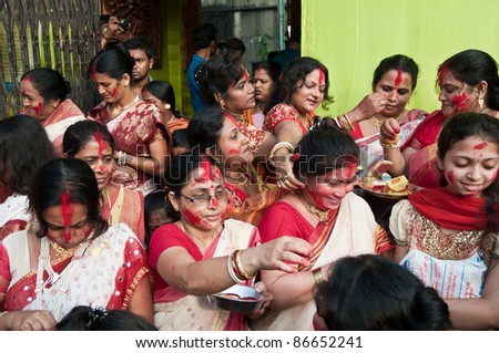 stock photo CALCUTTA OCTOBER 6 Married Bengali Hindu women smear and 