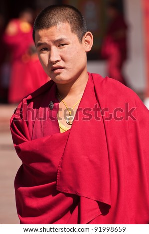 SIKKIM, INDIA - OCTOBER 27: A Tibetan monk attends the morning prayer ceremony at Rumtek Monastery on October 27, 2011 in Sikkim, India. Rumtek is the largest monastery in Sikkim.