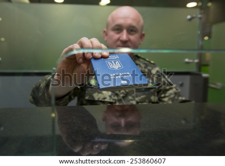 BORYSPIL, UKRAINE - FEBRUARY, 18, 2015: Specialists of the State Border Guard Service of Ukraine show the system biometric passports control at the airport 