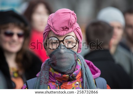 KIEV, UKRAINE - MARCH, 8, 2015: Civil society activists participate costumed in feminist march for women\'s rights. The protest takes place during the International Women\'s day.