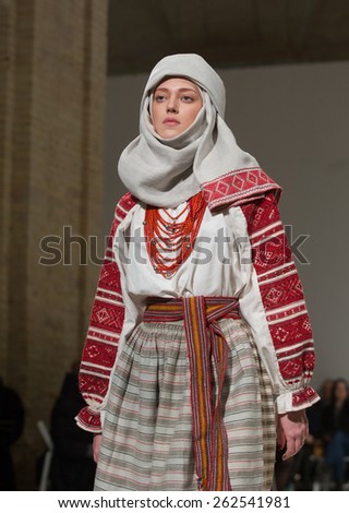 KIEV, UKRAINE - MARCH, 21, 2015: Models on the catwalk wears an authentic Ukrainian national costumes on the fourth day of the Ukrainian Fashion Week. This show is part of \