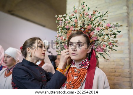 KIEV, UKRAINE - MARCH, 21, 2015: Models on the backstage wears an authentic Ukrainian national costumes on the fourth day of the Ukrainian Fashion Week. This show is part of \