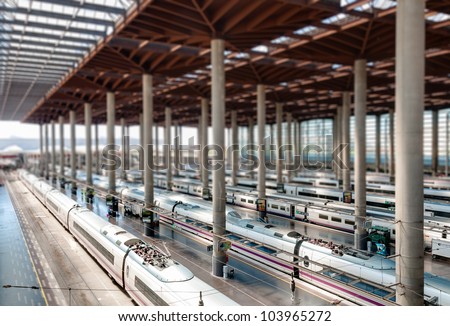 Atocha Madrid train station terminal. Modern station building with modern trains. Tilt shift effect. Madrid, Spain, Europe.