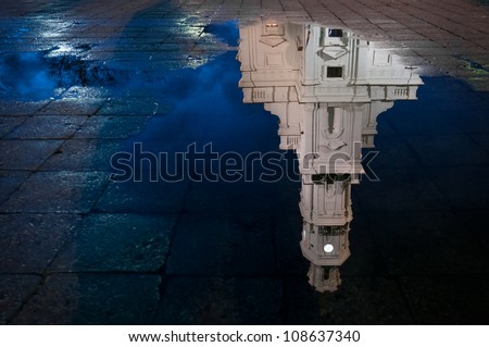 Town hall of Kaunas, Lithuania reflecting in water with blue night sky. Europe.