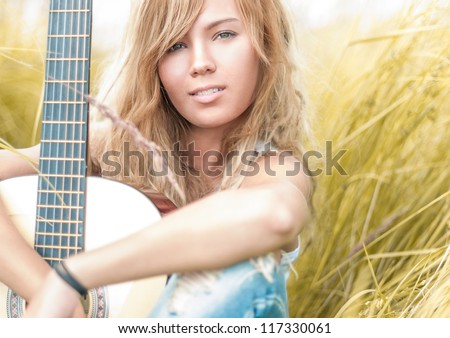 Pretty Girl With Guitar Sitting On Ground Beautiful Woman With Blonde