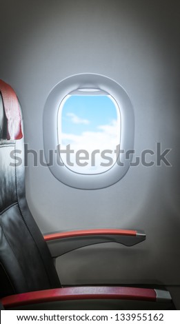 Side view of single empty seat in passenger airplane. Comfortable leather black seat with red armrests. Window with sunlight aside. Interior of plane. Travelling with comfort by air. Economy class.