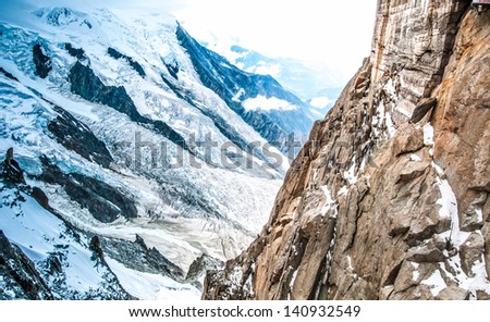 View of the Alps from Aiguille du Midi mountain in the Mont Blanc massif in the French Alps. Alps, France, Europe.