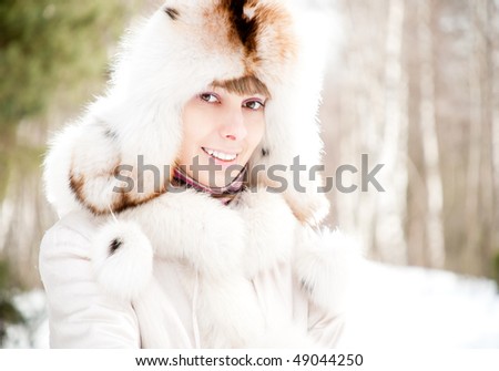 winter portrait of young and beautiful natural looking woman in casual clothes