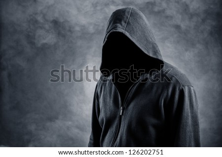 Invisible man in the hood.Background in smoke