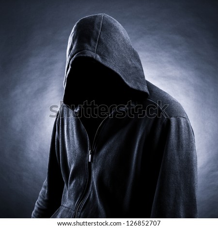 Invisible man in the hood.  Black  background.