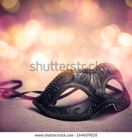 carnival mask over gold background