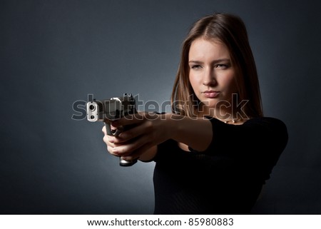 The young woman-agent on a black background