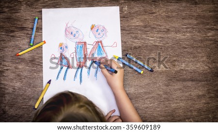 The child drawing a family