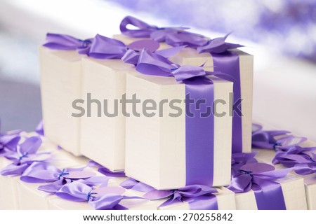 Group of presents with purple ribbons