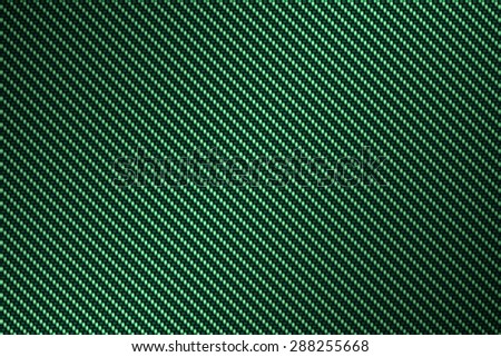 carbon kevlar texture background with green