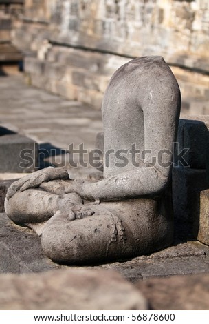 ruined statue of Buddha in Borobudur temple, Indonesia