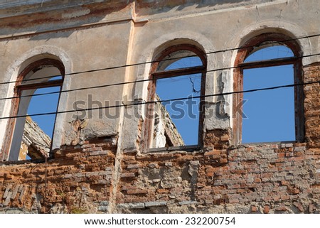 ruined house with arch windows