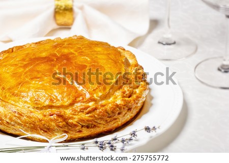 Traditional pie for a family holiday. Mother\'s cake. Beautiful meat, fish or vegetable pie with a golden crust. Wedding table setting. Table set for an event party or wedding reception.