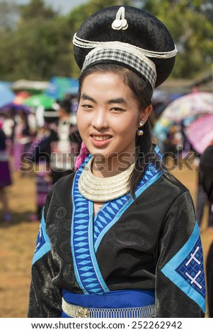 DOI MUSER, TAK PROVINCE, THAILAND FEBUARY  8, 2015 : Unidentified Hmong hill tribe woman in traditional clothes poses and looks at camera in \