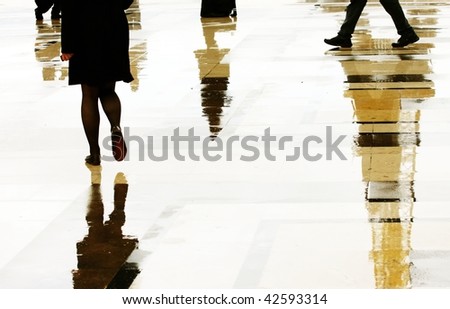 reflection of people walks in street