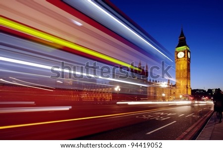 Big Ben at night with bus in motion blur