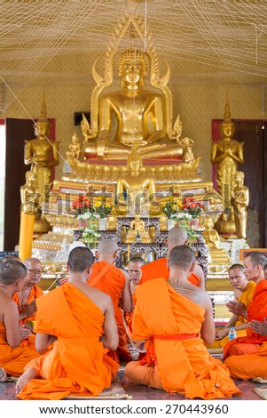 BANGKOK,THAILAND April 12 : Newly ordained Buddhist monk pray with priest procession. Newly ordained Buddhist monks have a ritual in the temple procession in April 12, 2015