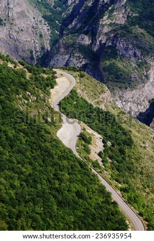 Mountain road along the cliff to Tatev monastery in Armenia