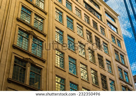 The windows of a Downtown Dallas office building glistening in the light