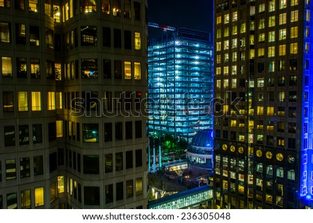 A view between two office buildings at a newly constructed office building at night