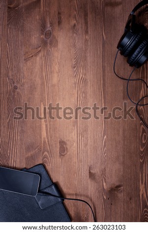 dark wood. clear table. business. work. music. headphones