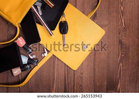 handbags. everyday woman\'s things. desktop dark wood