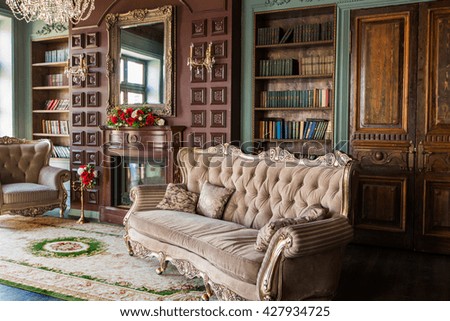 Luxury interior of home library. Sitting room with elegant furniture