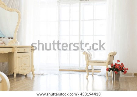 Luxury stylish bright light interior of apartment. White walls decorated by ornament. Nobody inside room. bedroom.