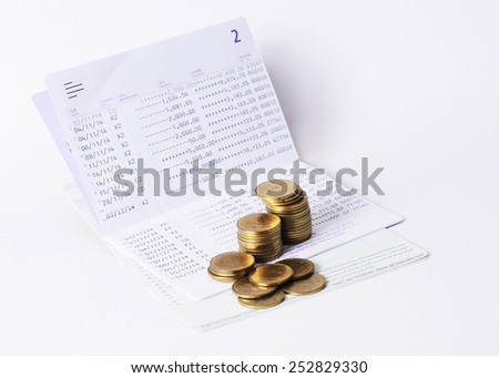 Money Coins stack and book bank saving plan for loan concept
