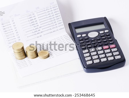 Money coins stack and calculator and book bank loan money concept
