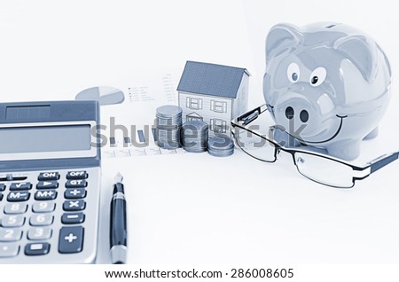 Blue tones style for Saving money plan with piggy bank and paper house and eyeglasses and calculator and fountain pen