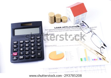 Loan application form and money coins stack and calculator and h