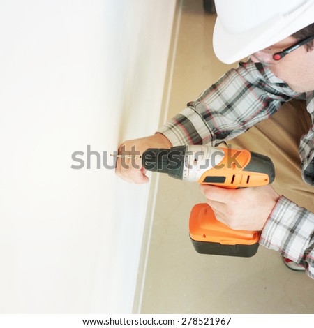 man  with electric drill