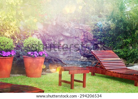 Comfortable lounge chair in a small garden