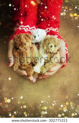 Christmas toy bear  in woman hands