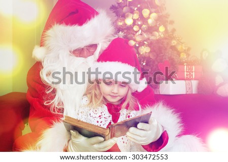 Santa Claus reading book with little cute girl