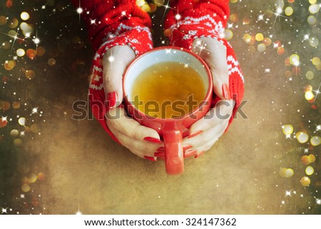 Woman hands holding tea mug