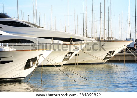 Vacations And Tourism Concept, Beautiful white modern yachts at sea port Alicante, Spain