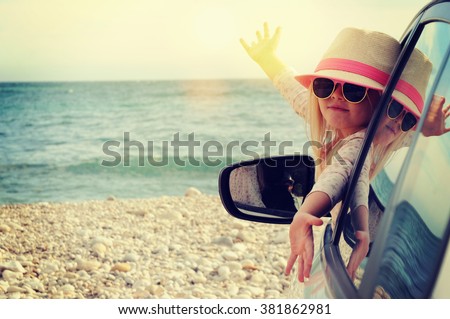 Vacations And Tourism Concept, Little girl in the rent car