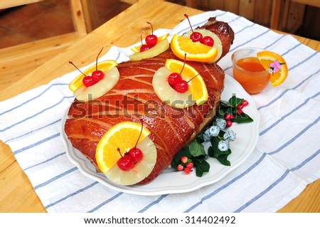 Baked ham with honey glaze with pineapple