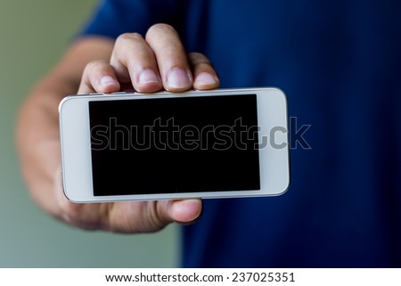 man show his smart phone, smart phone in the hand