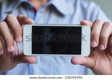 man show his smart phone, smart phone in the hand