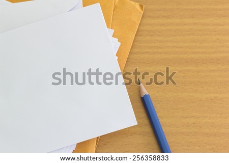 pile of envelope and pencil with  free space for text