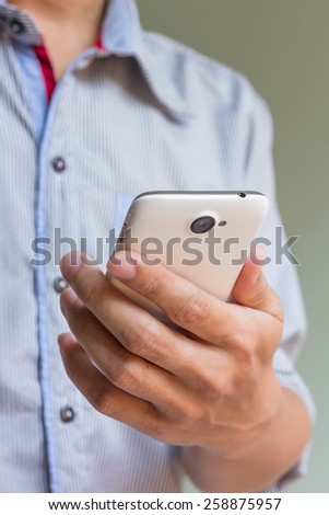 businessman is holding his smart phone