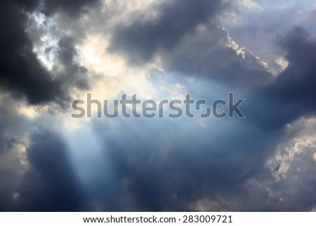 rain cloud and sun beam after storm